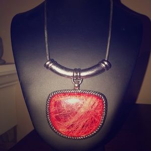 Necklace with large coral colored medallio…